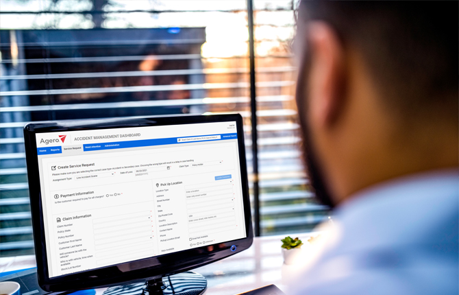 Agero Accident Management Dashboard - man on computer