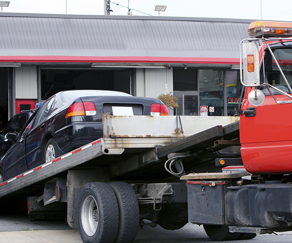 Car is offloaded from tow truck