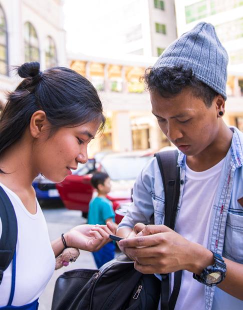 Young Asian Couple Paying for Parking on App - Agero