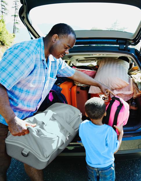 Dad and Son packing car for Spring break Trip - Agero