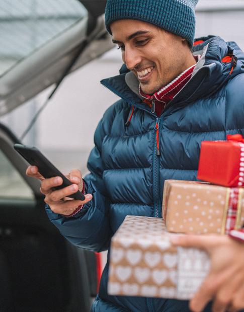 Agero Man Carrying Holiday Packages for Deliver
