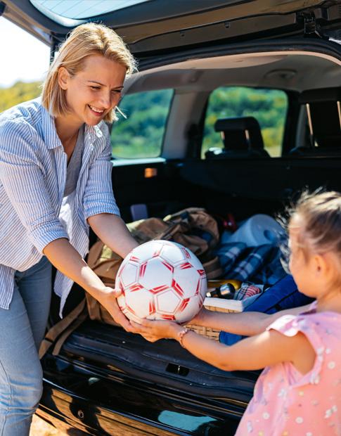 Agero - Mom & Daugther; soccer ball back of vehicle